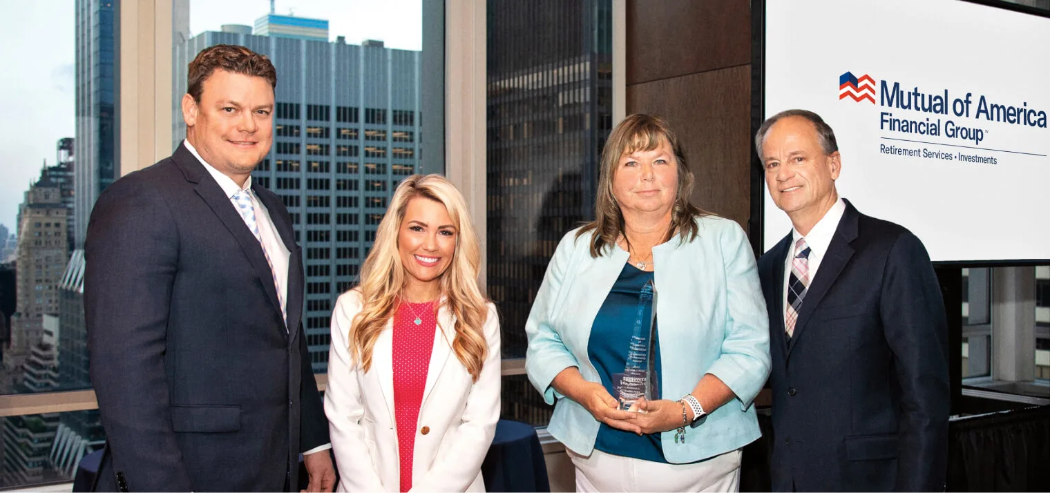 2022 Community Partnership Award Event (l–r): Brian Severin, Senior Executive Vice President and CMO, Mutual of America Financial Group; Lisa Loughry, Chair, Mutual of America Foundation; Lori Stevens, Founder and Executive Director of Patriot PAWS Service Dogs; John R. Greed, Chairman, President and CEO, Mutual of America Financial Group.